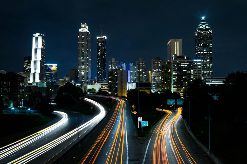 pexels-photo-134643-134643 A vibrant cityscape at night showcasing light trails on the highway beneath towering skyscrapers.