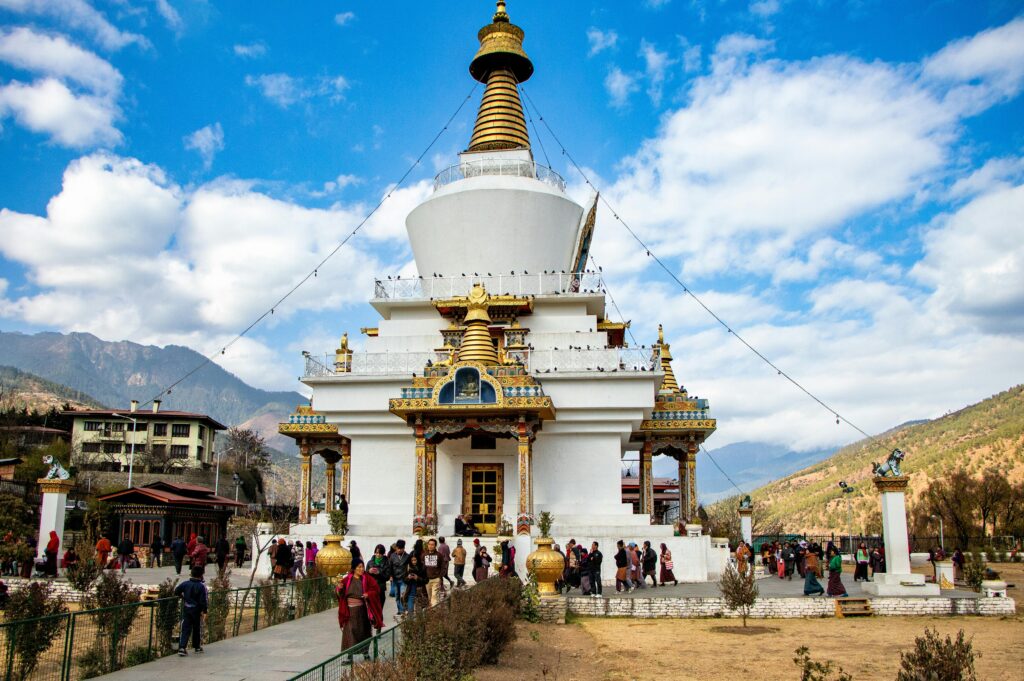 pexels-photo-18695377-18695377 A vibrant view of Memorial Chorten, a religious landmark in Thimphu, Bhutan, surrounded by visitors.