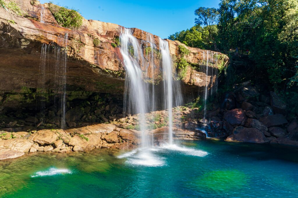 pexels-photo-19469036-19469036 Beautiful Krang Shuri Waterfall with clear blue water and lush green surroundings in Meghalaya, India.