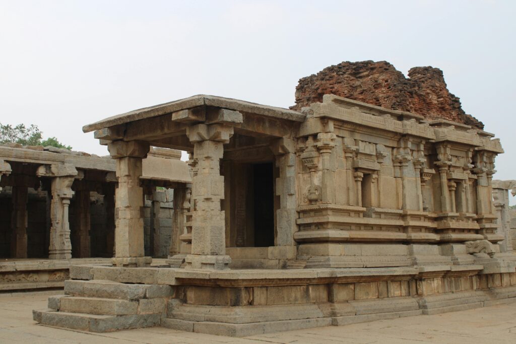 pexels-photo-27926507-27926507 Explore the stunning ancient stone temple ruins featuring intricate columns and architecture.
