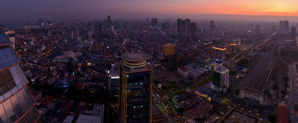 pexels-photo-3864243-3864243 Stunning aerial view of Phnom Penh's cityscape at sunset, showcasing urban architecture.