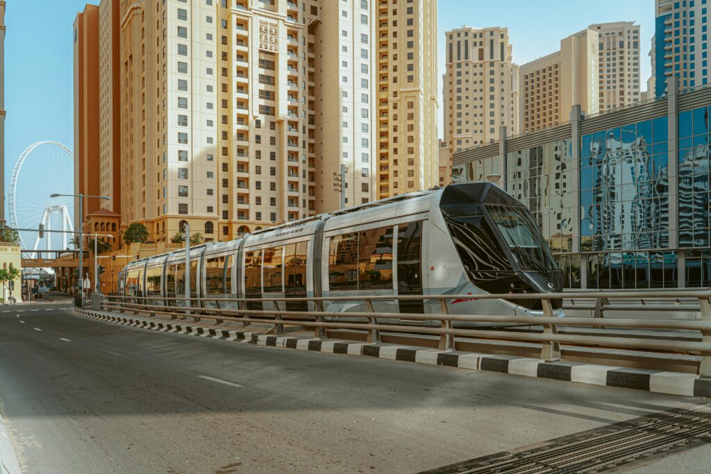 pexels-photo-4491946-4491946 A sleek tram reflecting the urban skyline of Dubai, United Arab Emirates.