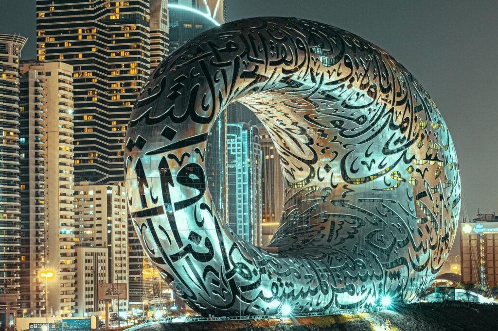 pexels-photo-7199827-7199827 The iconic Museum of the Future illuminated at night in Dubai, showcasing its innovative architecture.