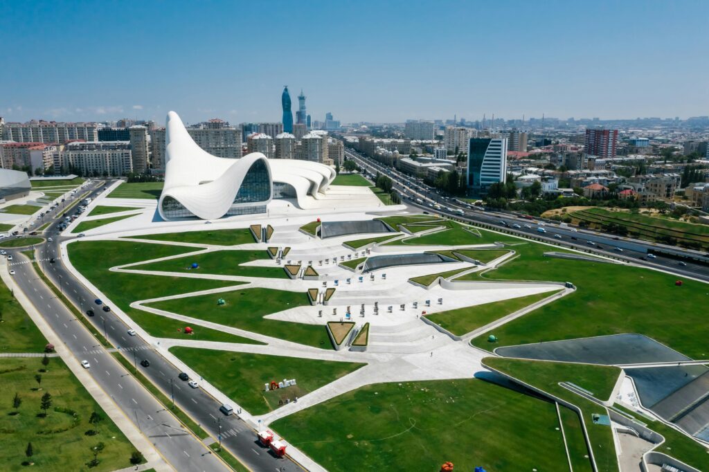 pexels-photo-8412668-8412668 Stunning aerial shot of the Heydar Aliyev Center and urban landscape in Baku, Azerbaijan.